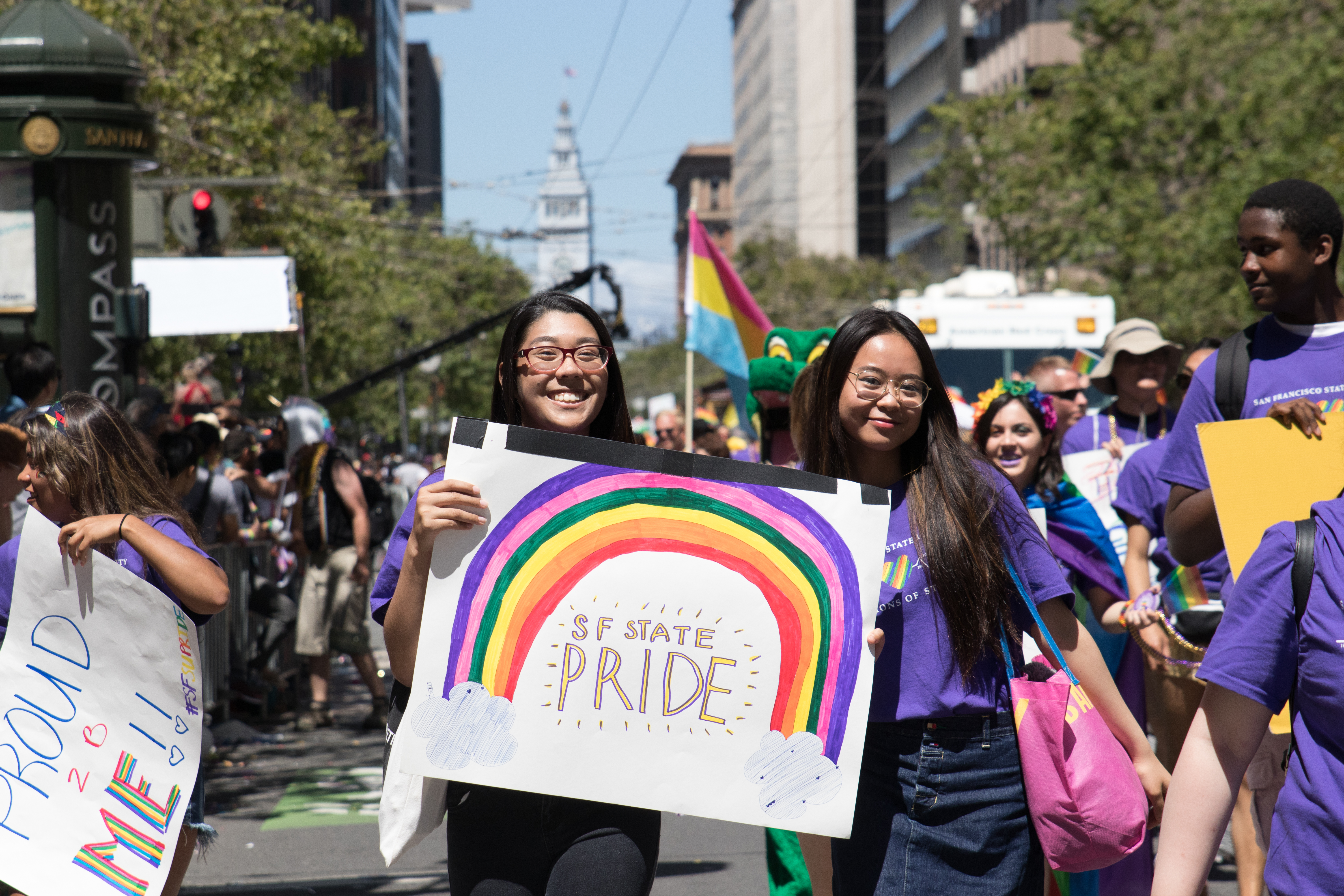 Students holding a pride sign