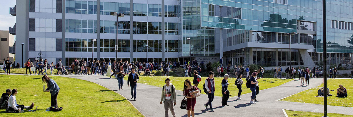Students walk past J. Paul Leonard Library on SF State Campus