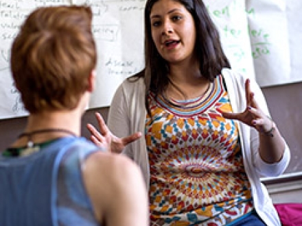 Woman talking to student